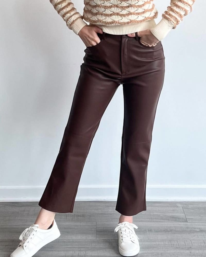 Front of a model wearing a size Large Lani Pu Pant in Chocolate in Chocolate by MINKPINK. | dia_product_style_image_id:338574